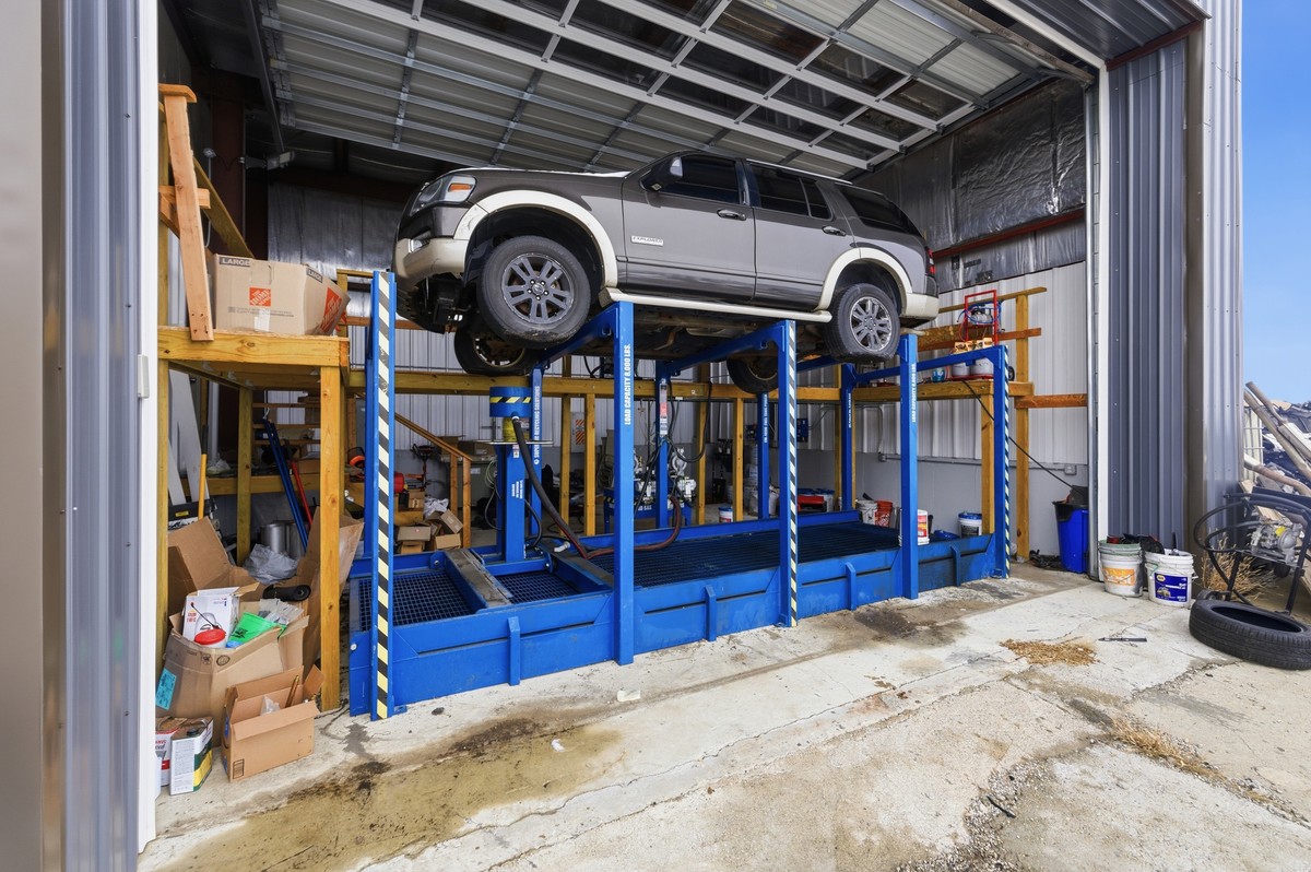 A Ford Explorer up on the dismantling lift in our shop